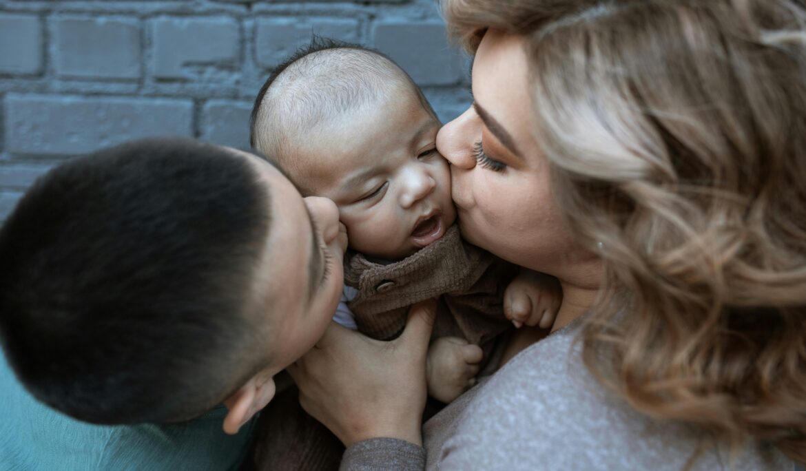 kissing a baby on the ear